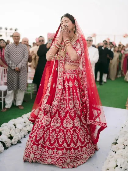 A candid shot of the bride's grand entrance. Her hands, adorned with my mehndi, add to the grace and beauty of the moment.