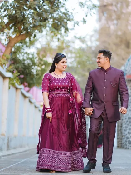 A happy, candid shot of the couple walking hand-in-hand after their Catholic wedding ceremony. Their smiles and easy stride show their joy and comfort with each other.