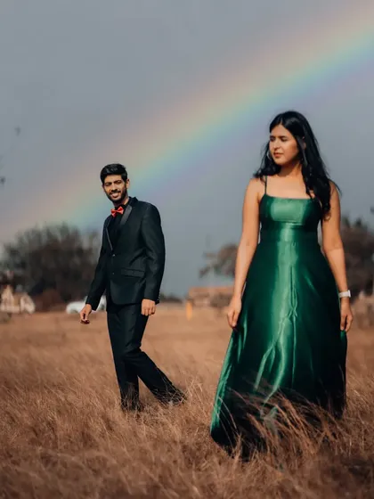 A touch of magic with a rainbow appearing during this outdoor couple's portrait session. We embrace spontaneous moments like these to create truly unique and breathtaking pre-wedding photographs in natural settings.