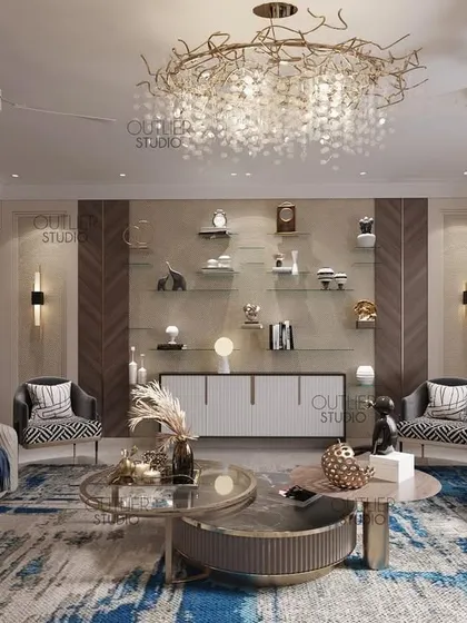This living room uses a bold blue and white abstract rug as its centerpiece. The design is complemented by a stunning branch-like chandelier and a mix of neutral and patterned seating.