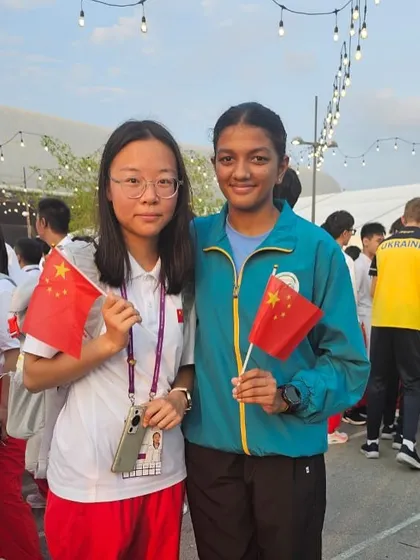 Sanisska representing our academy and country on an international stage, pictured here with a fellow athlete from China.