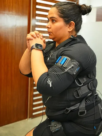 A close up of Sumukhi Suresh's focus and determination during her EMS session. It's all about that mind muscle connection.