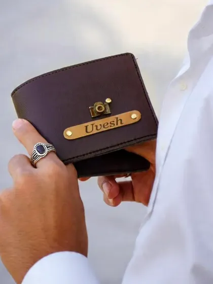 A personalized gift becomes a part of your daily life. Here is a look at how my custom brown leather wallet, engraved with a name and a camera charm, looks when you carry it. It’s a stylish and practical accessory for everyday use.