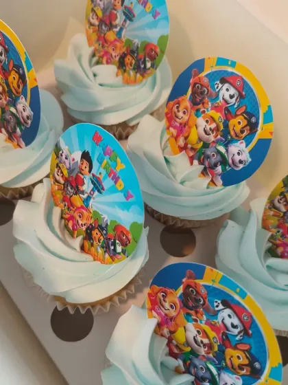 Paw Patrol is on a roll! These vanilla cupcakes with light blue frosting are topped with edible images of the whole Paw Patrol team, perfect for a young fan's birthday.