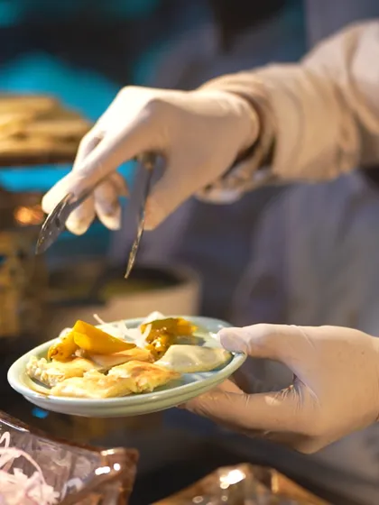 A close-up of a plate being served, showcasing the care and precision our team takes with every single dish.