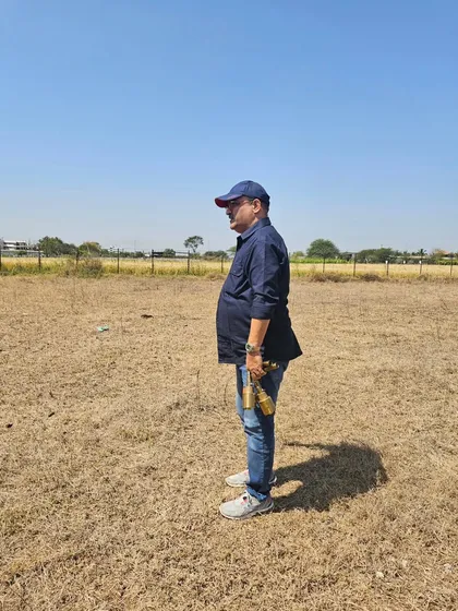 Scanning an open plot of land to determine its energy levels and suitability for construction. Not all land is conducive to positive living, and this is the first thing I check.