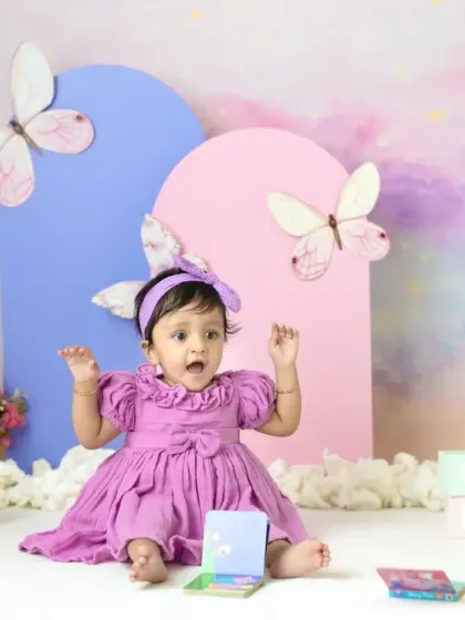 A magical unicorn and butterfly theme for a first birthday. The pastel colors, whimsical props, and dreamy backdrop create a true fairy tale setting.