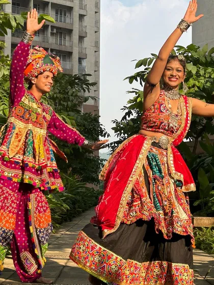Another angle of this dynamic duo. You can see how the outfits allow for a full range of motion, which is essential for Garba.