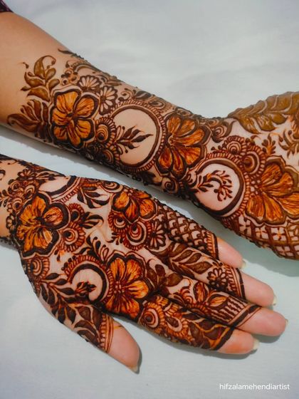 Another angle of the hibiscus flower henna, showcasing the pattern on the back of the hand and wrist.