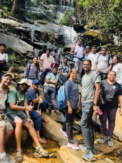 Another group enjoying a break at a small waterfall along the Netravathi trail.