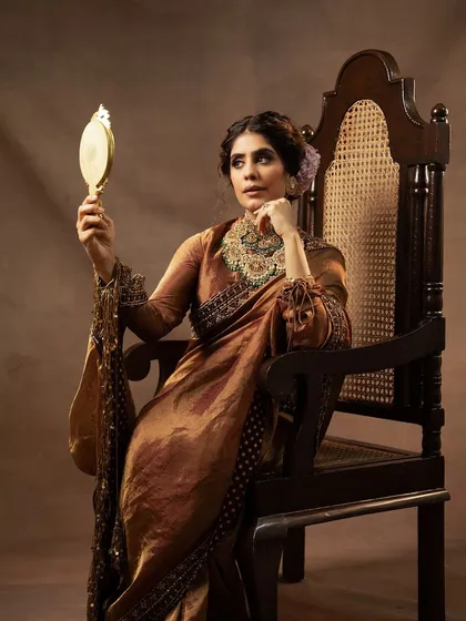This portrait, shot for a collaboration between Jayanti Reddy Label and Kishandas Jewellery, is all about capturing a mood of regal elegance. I used soft, directional lighting to sculpt the model's features and bring out the rich textures of the silk saree and the exquisite detail of the heritage jewellery.