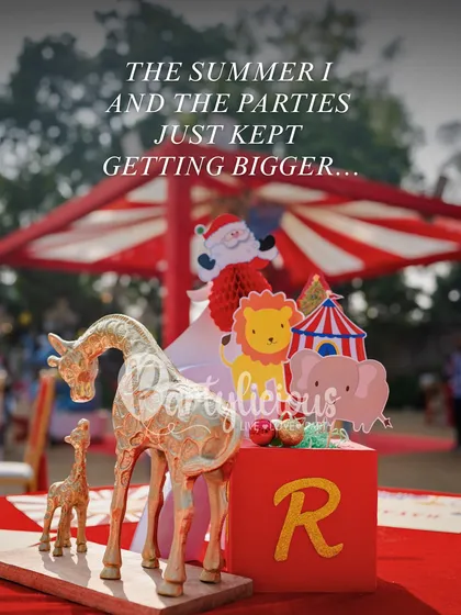 The summer I... and the parties just kept getting bigger. A detail shot from a carnival-themed party with golden giraffe and circus props.