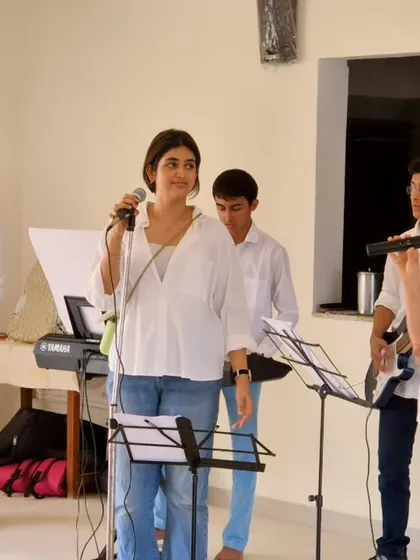 Our band performs a collection of classic Bollywood songs, bringing smiles and memories to the residents. The setup includes multiple vocalists and instrumentalists.