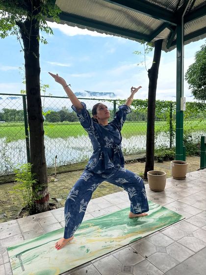 The Reverse Warrior pose, a beautiful heart-opening asana. It feels incredible to stretch and reach for the sky, especially when you are surrounded by so much greenery.