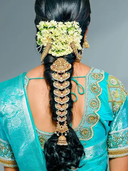 Don't forget the final touch. I offer beautiful jadai sets for rent to adorn your bridal hairstyle, featuring intricate designs that perfectly match our temple jewellery collections.
