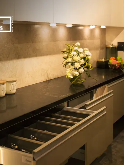 Well-placed spotlights and under-cabinet lighting ensure that every part of the counter is well-lit, making meal prep easier and safer.