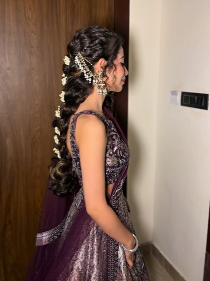 A side profile showcasing the beautiful braid and the elegant hair accessory.