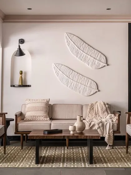 Inspired by tropical modernism, this living space is designed to feel like a getaway. We used natural materials like cane and wood for the custom armchairs and sofa, creating a relaxed yet refined atmosphere that celebrates tactile, organic design.