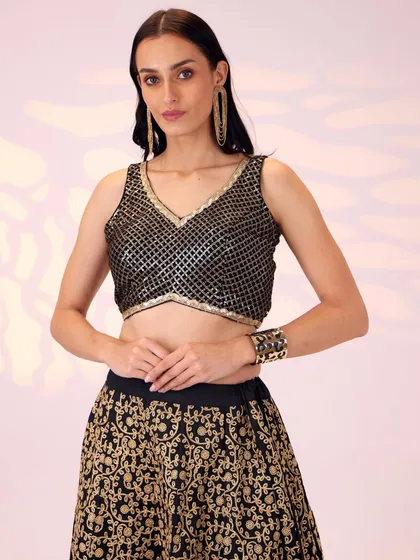 Every special moment deserves an extraordinary outfit. I believe in timeless elegance, which is why I meticulously crafted this black and gold lehenga. It's designed for the modern bridesmaid or the sister of the bride who celebrates tradition with a contemporary twist.