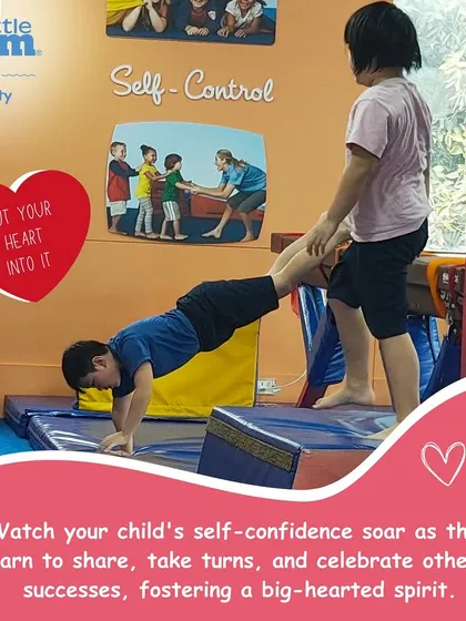 We encourage teamwork and support. Here, one child helps another with a wheelbarrow walk, a great partner exercise for building strength and trust.