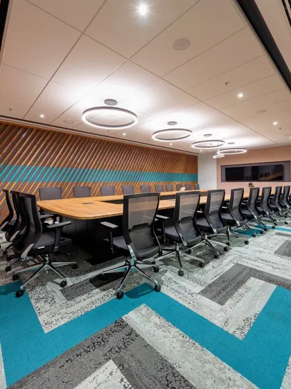 Another view of the corporate boardroom, showing the U-shaped table configuration that is ideal for presentations and large group discussions.