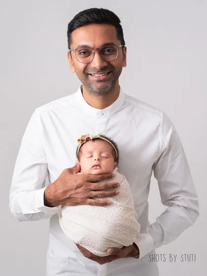 A father holding his precious newborn. These are the moments that define the beginning of fatherhood.