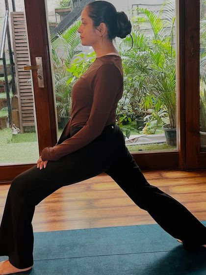 Warrior I pose, a foundational posture for building leg strength and opening the hips.