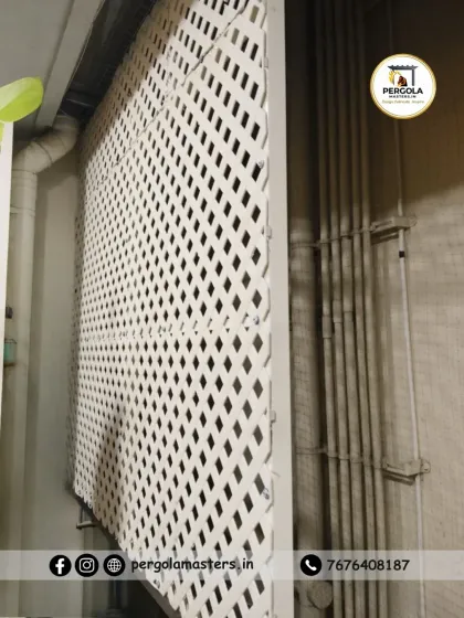 This image shows how our lattice screen can be used to conceal utility pipes and service areas while still allowing for necessary airflow and access.