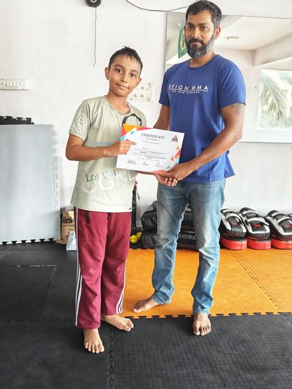 A huge congratulations to this young fighter for completing the summer camp. Our program is designed to build discipline and focus in a supportive setting.