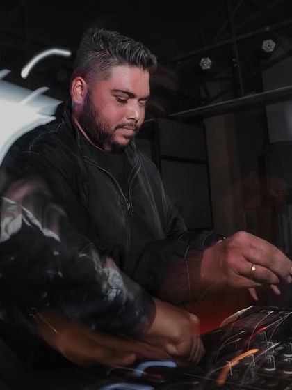 A motion blur shot capturing the fast-paced action of mixing live at a college festival. It's all about quick transitions and keeping the momentum going.