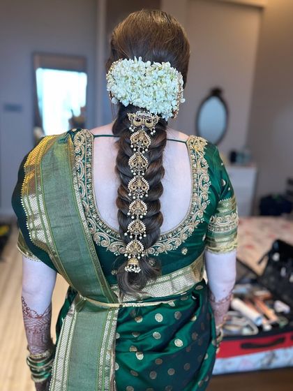 The complete bridal look, showcasing the stunning South Indian braid from top to bottom. This hairstyle is rich in tradition and designed to make a bride feel like royalty.
