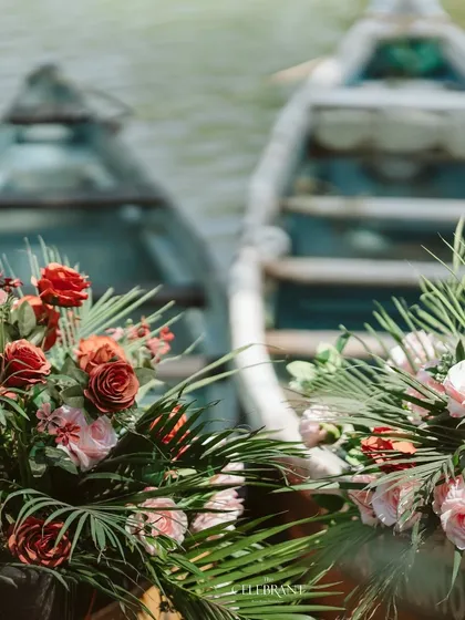 A unique selfie booth idea for a waterside Mehendi. I filled these boats with beautiful floral arrangements, creating a fun and thematic photo opportunity for guests.