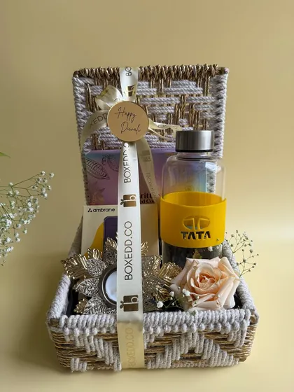 We love bringing a brand's vision to life. This custom Diwali hamper for TATA features a branded water bottle and other curated items, all presented in a beautiful woven basket that reflects both quality and festive warmth.