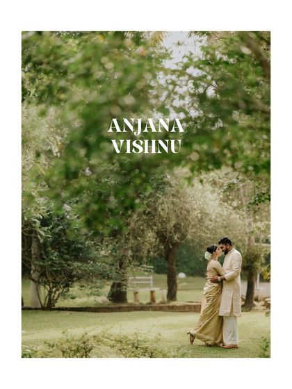 A wide, romantic shot of the couple in a beautiful park setting, capturing the beginning of their story with elegance and simplicity.
