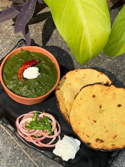 Nothing says winter comfort like our classic Sarson Ka Saag served with hot Makai Ki Roti. This traditional Punjabi dish is slow-cooked with fresh mustard greens and spices for an authentic, heartwarming flavor.