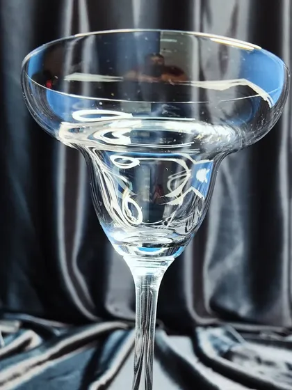 A classic margarita glass, perfect for serving margaritas and other frozen cocktails. The wide rim is ideal for a salt or sugar garnish.