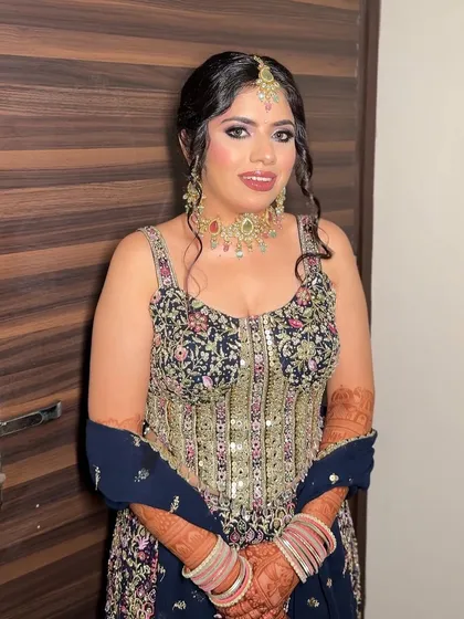 My bride Chandni, looking radiant for her Mata ki Chowki. We created a soft glam look with a focus on her eyes to complement her heavily embellished outfit.