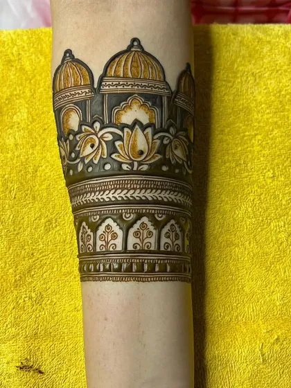 Another angle of the palace architecture band, showing the fine line work and the lotus flowers beneath the domes.