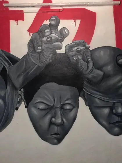 This mural, titled 'STATES OF MIND', is a large-scale piece exploring different human emotions. I used varied shading techniques on each face to give them a distinct character and depth.