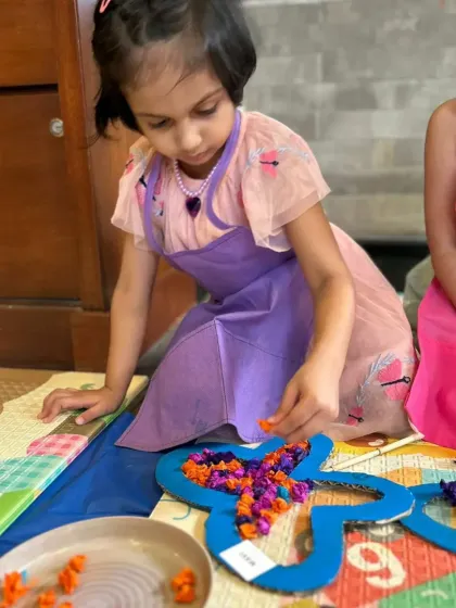 Another one of our butterfly-themed crafts involved creating textured art by placing colorful paper into a butterfly frame. This activity is great for developing fine motor skills while having fun.