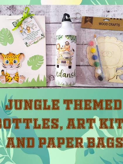 This flat-lay shows all the components of my jungle adventure hamper: a personalized bottle, a themed paper bag, and a wooden art kit ready for painting.