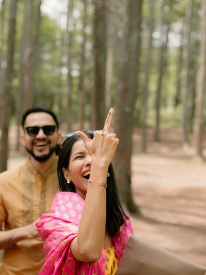 A candid moment of pure fun and cheekiness during the Haldi celebrations. It's the unscripted, playful interactions that truly show a couple's personality.