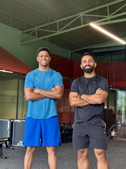 Standing with a partner at our new Bengaluru location. Building a strong team is crucial, and I'm excited for the new transformations we'll create here.