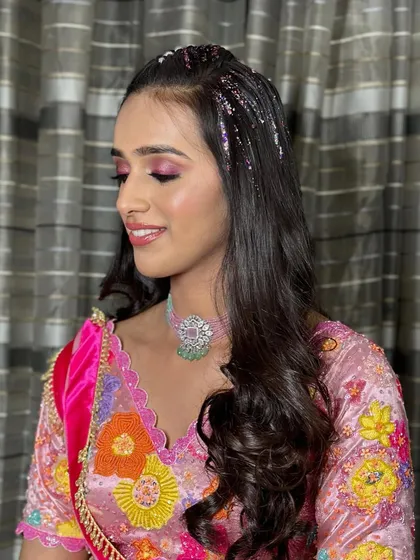 A side view of the glitter hairstyle, showing how it sparkles and catches the light. It's a fun and trendy look for a bride-to-be.