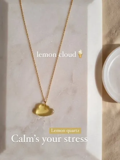 The lemon quartz cloud pendant, designed to calm your stress. This stone is excellent for reducing anxiety and helping you concentrate.