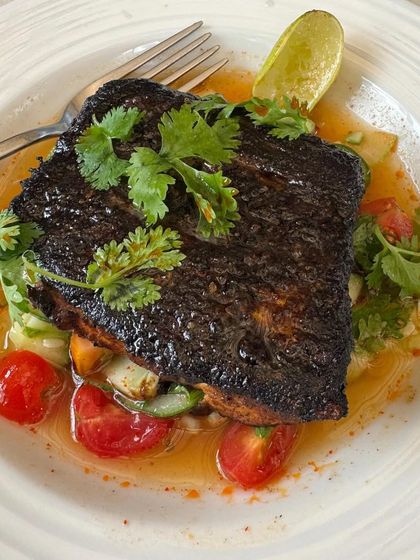 The blackened fish at Neighbors Goa was a standout dish. I make sure to capture food with interesting textures and colors, using natural light to make it look as fresh and delicious as it was.