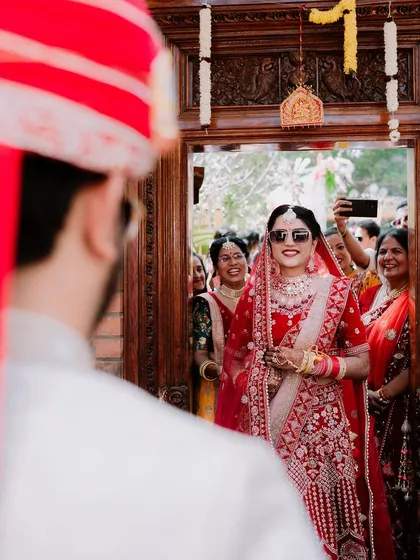 The bride's grand entrance, a cool and modern take with sunglasses, as she sees her groom for the first time.