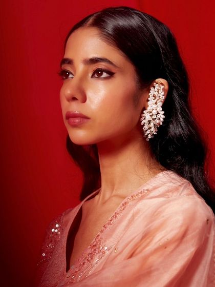 A festive season drop. This model showcases our stunning crystal leaf earcuff, a statement piece designed to make you stand out at any party or celebration.