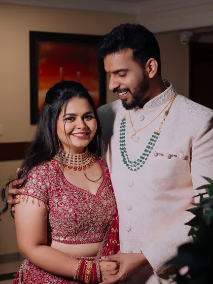 The couple at their ring ceremony, looking happy and in love.