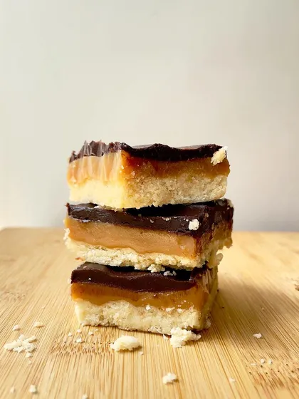 Introducing our Regal Riches, also known as millionaire's shortbread. A crumbly shortbread base is topped with a layer of chewy caramel and finished with rich dark chocolate.